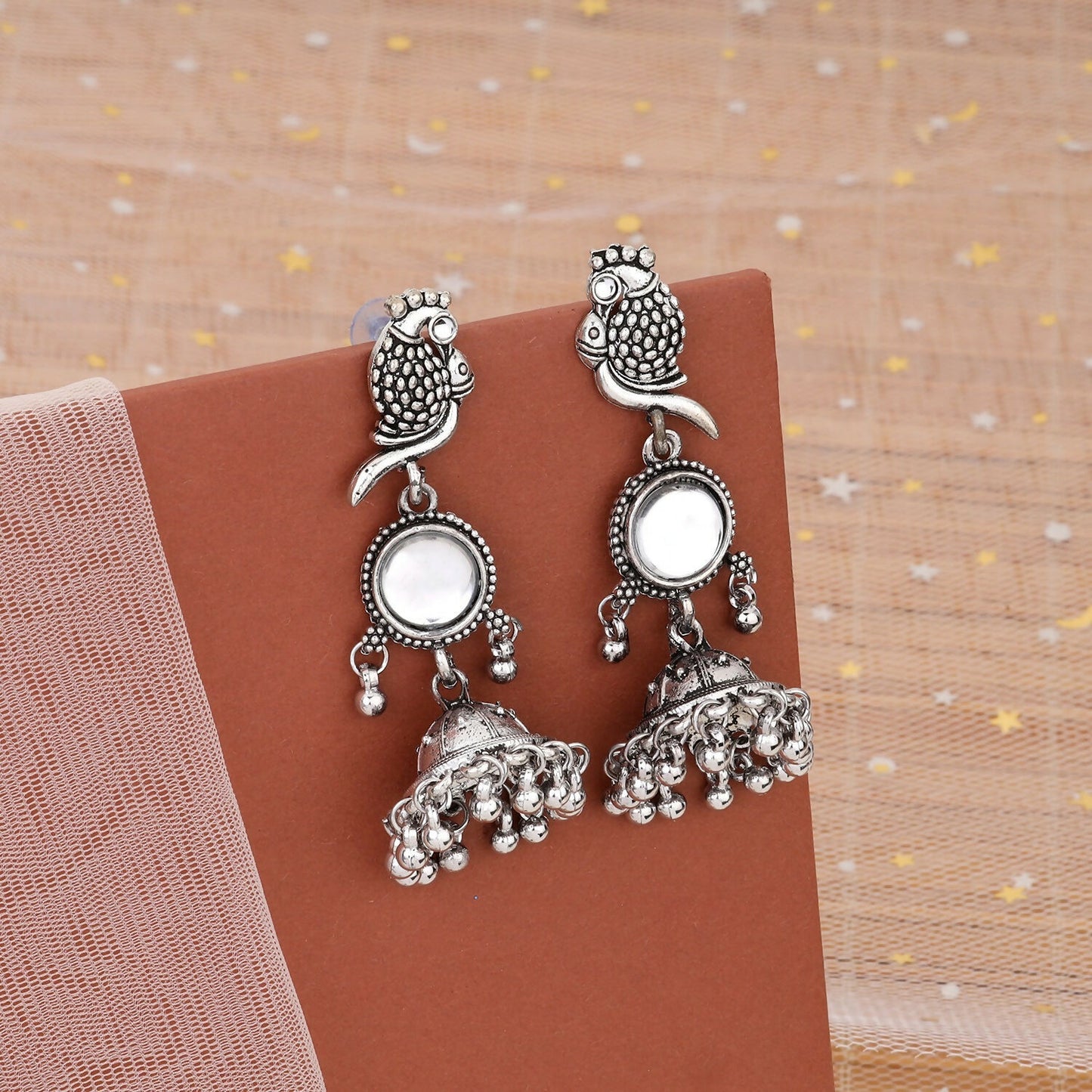 Silver Peacock Jhumka Earrings showcasing intricate oxidised silver peacock motif