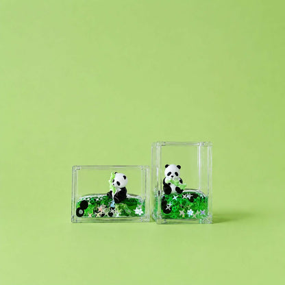 Transparent block with floating glitter and panda figure inside