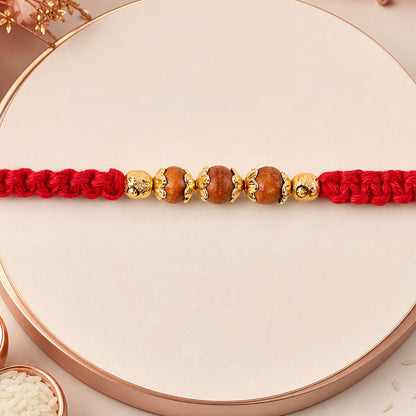 Red Braided Rakhi with Natural Wooden Bead Pendant Accents