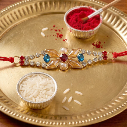 Pastel Floral Kundan Rakhi with Blue Stone and Pearl Center