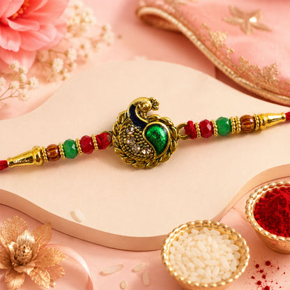Green Peacock Paisley Rakhi with Golden Detail, Festive Beads and Red Thread