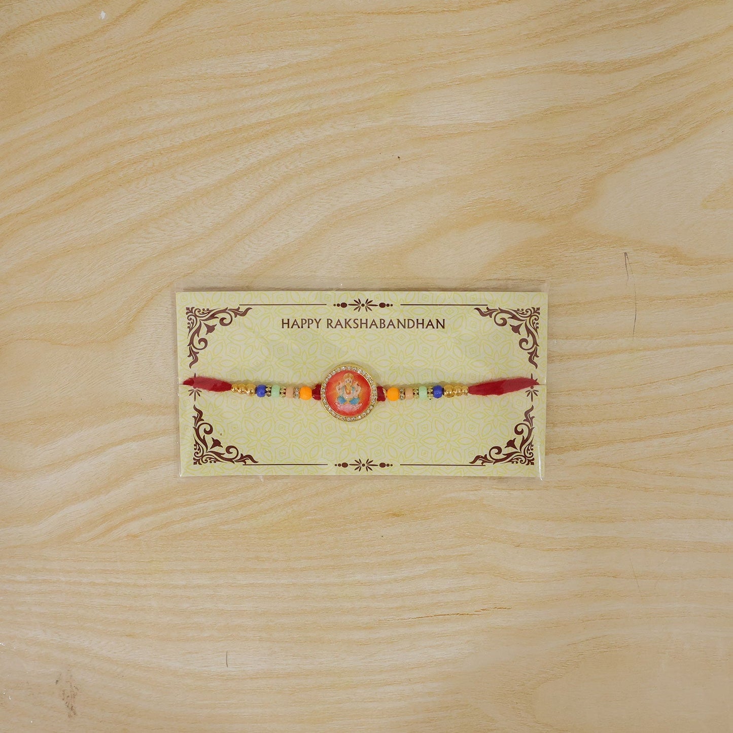 Ganesha Rakhi for Brother Golden Motif with Stones & Beads (5pcs)