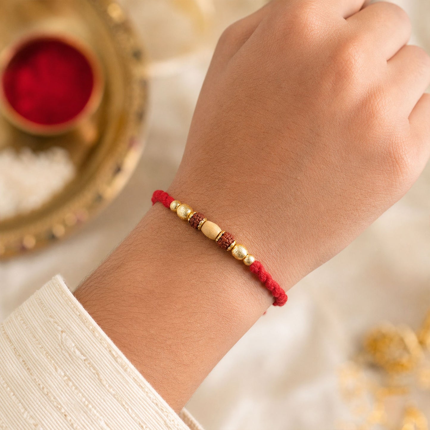 Red Thread Rakhi with a Row of Natural Rudraksha Bead Pendant
