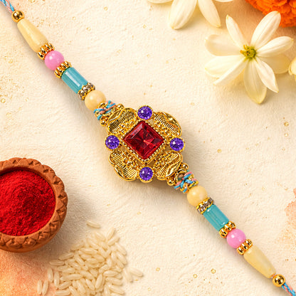 Ornate Rakhi showcasing Square Crystal Charm, gift finish and chain look for Gift Use
