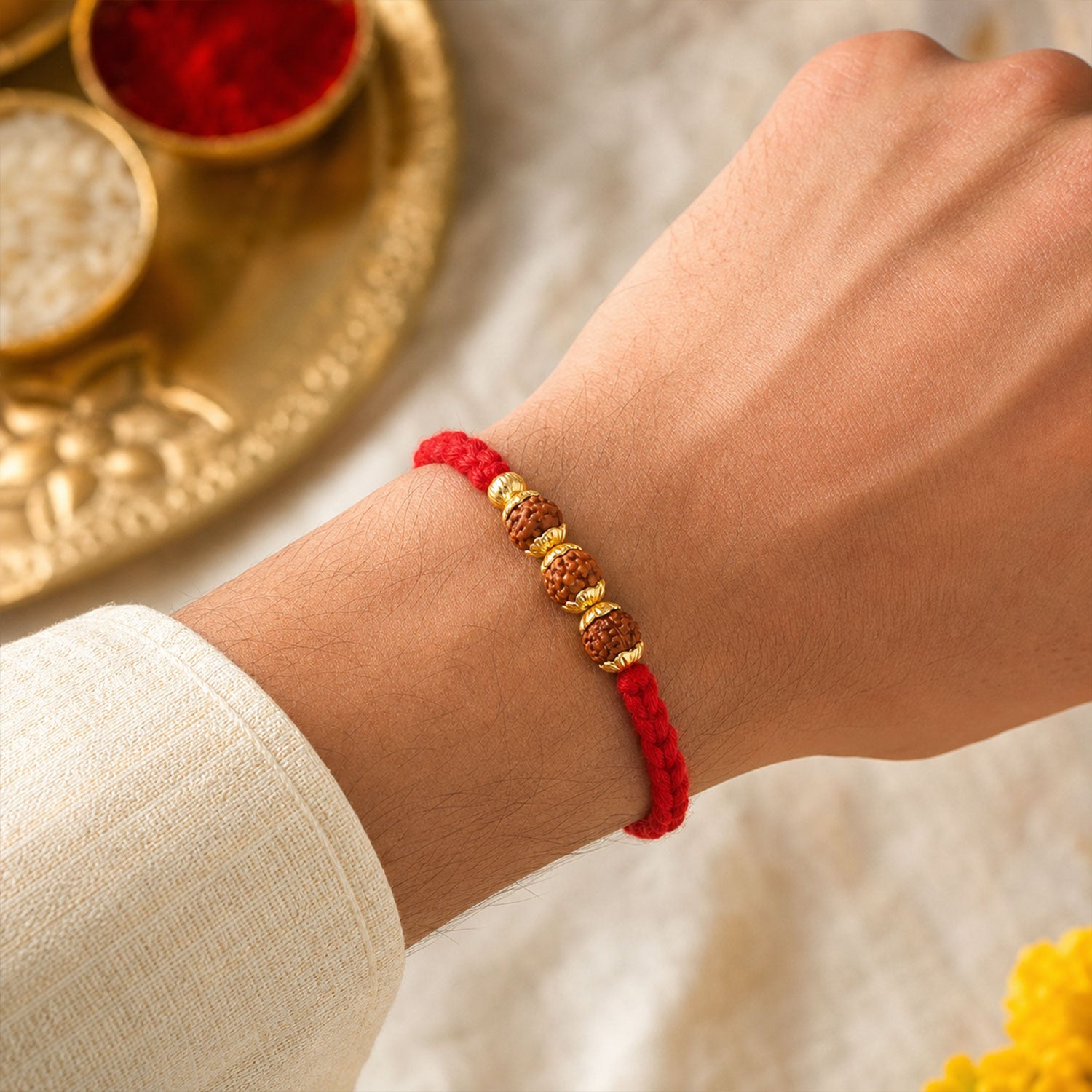 Red Thread Rakhi with a Row of Natural Rudraksha Bead Pendant