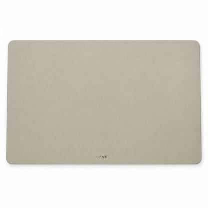 A plain light beige rectangular mat with rounded edges is displayed against a white background.