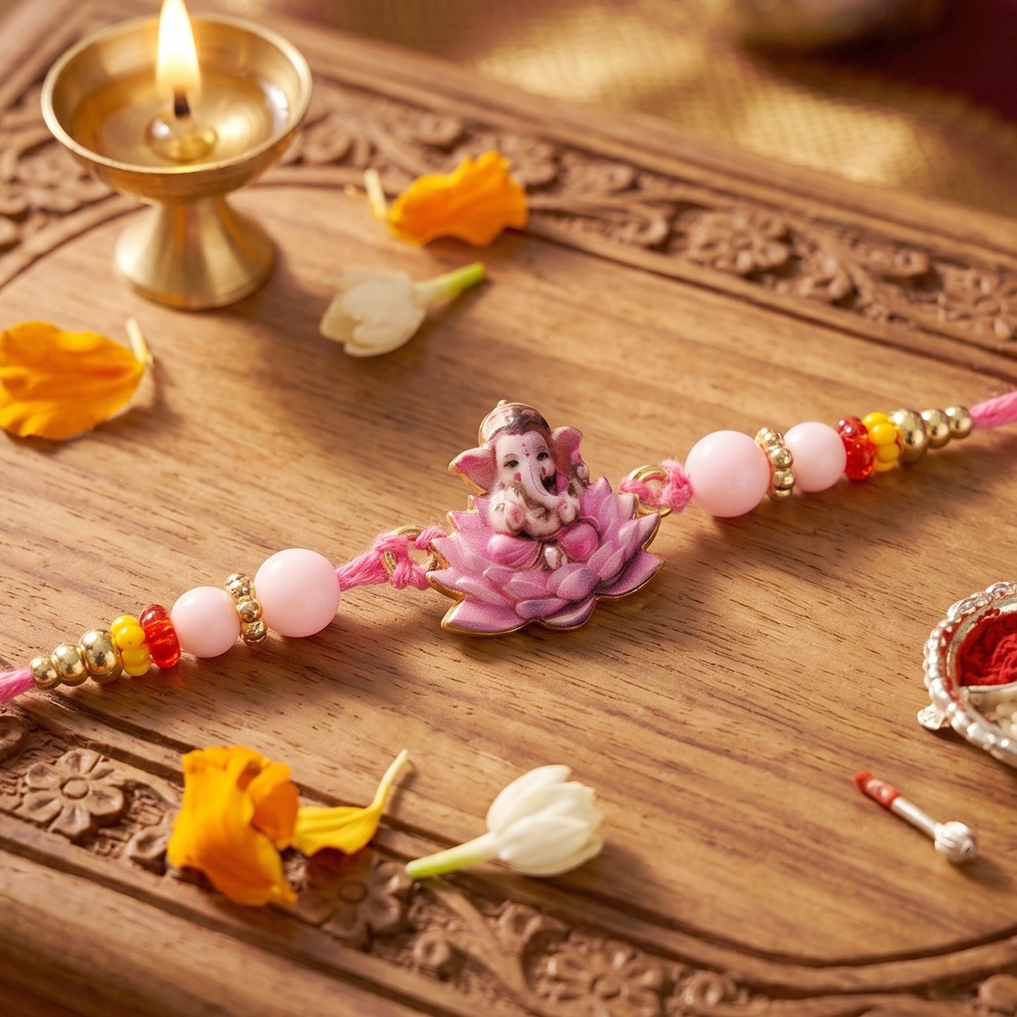 Lord Ganesha on Pink Lotus Designer Rakhi