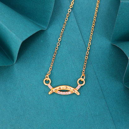 Close-up of gold plated necklace's marquise-shaped charm with pavé cubic zirconia detailing