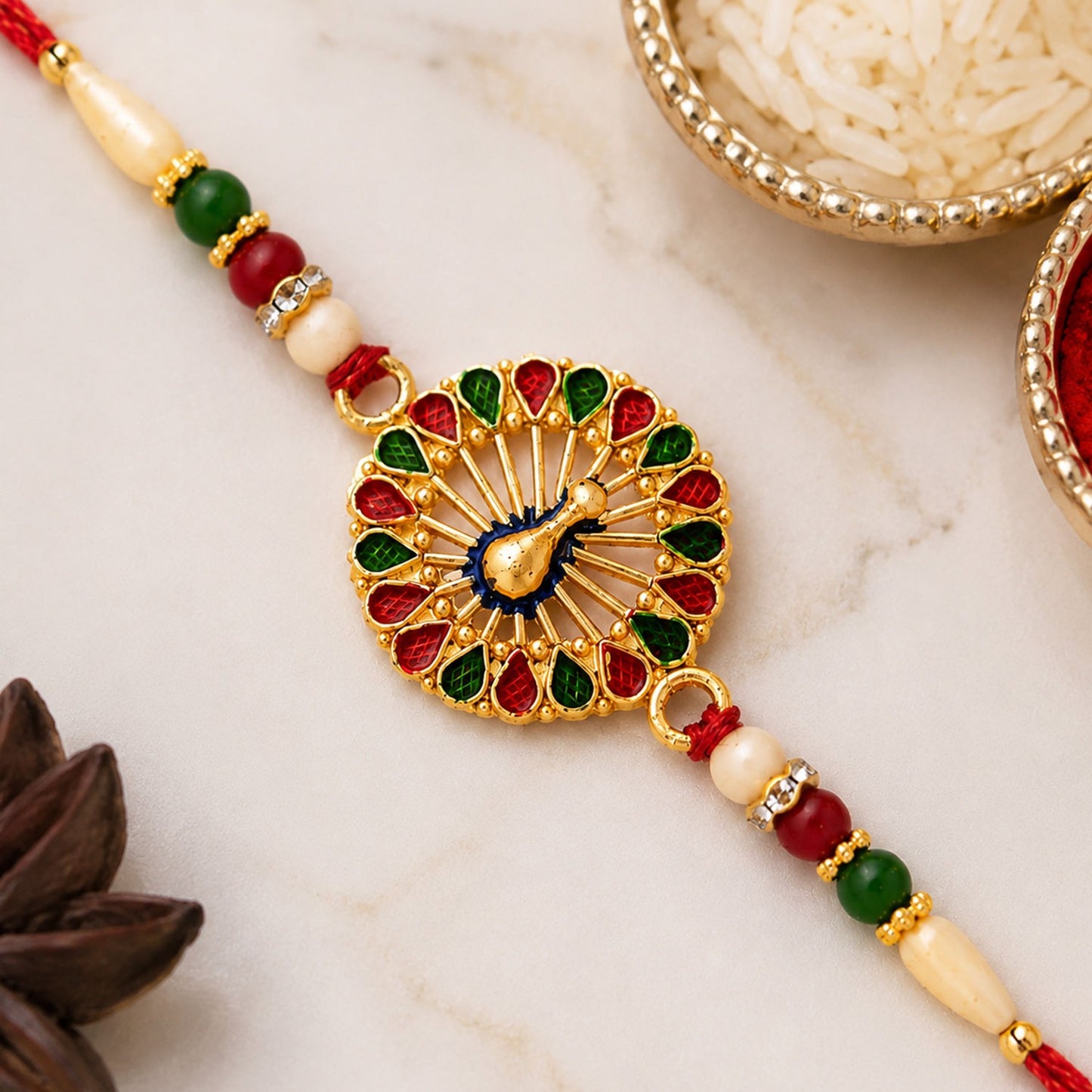 Close up of Vinayak Vrat Rakhi's intricate design and skin-friendly threads on a brother's wrist