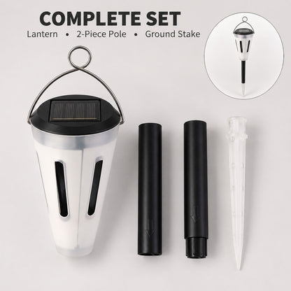 The complete set of a solar garden light, including the lantern, two-piece pole, and ground stake, is laid out on a gray