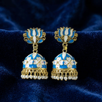 Detailed shot of intricate golden and blue design on earrings