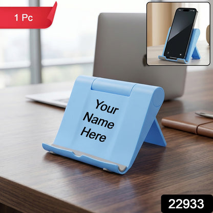 Detail view of a foldable phone stand with anti-slip cradle pad.