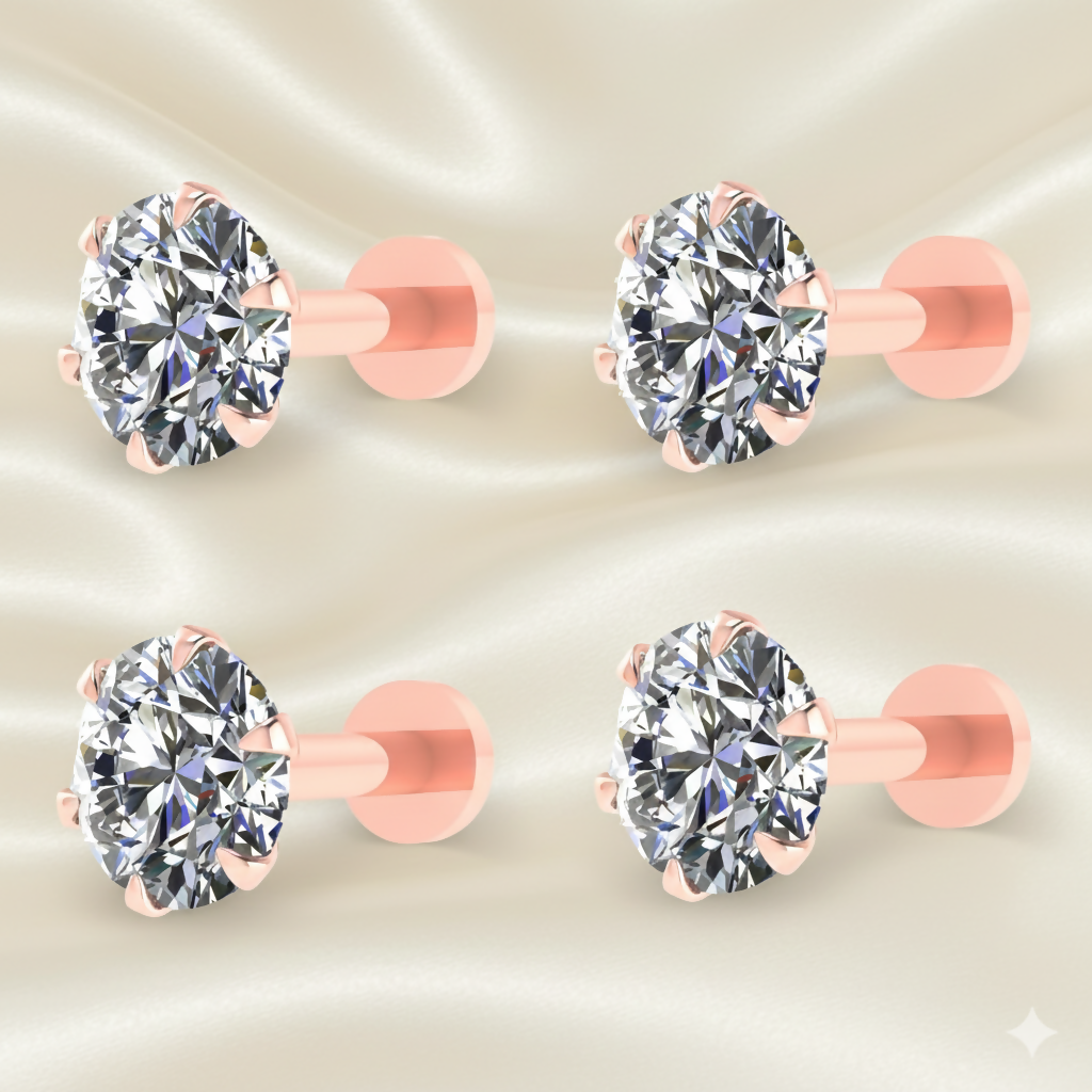 Close up of rose plated solitaire stud earring showing round cut stone and flat-back post design