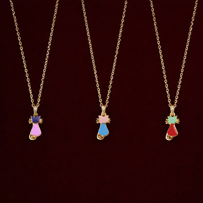 Close-up of gold cat pendant necklace showing vibrant enamel details