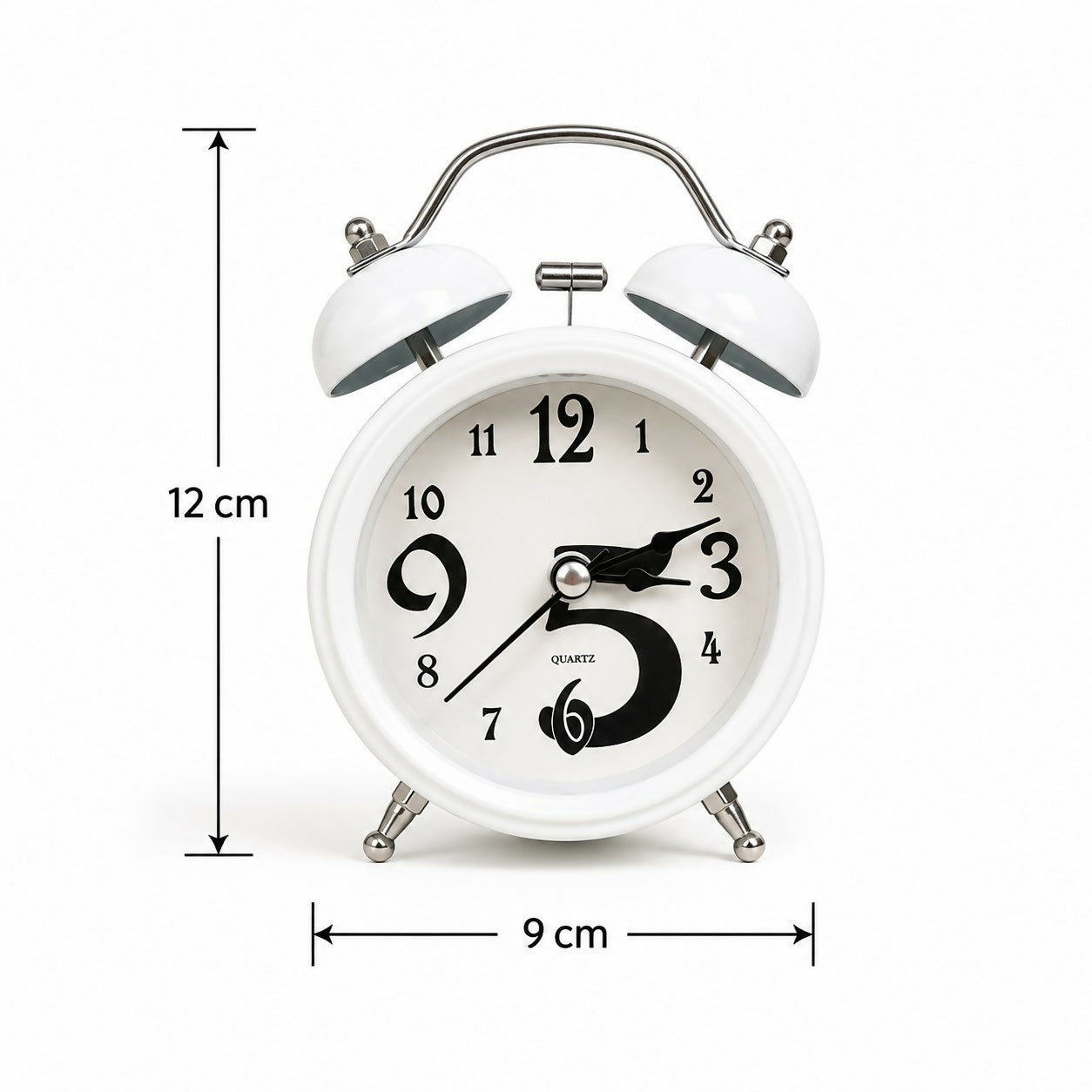 Retro style metal twin bell alarm clock on desk