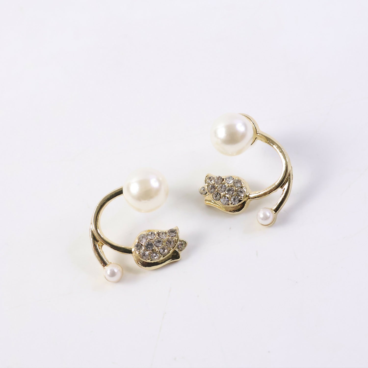 Elegant golden finish on pearl crystal stud earrings