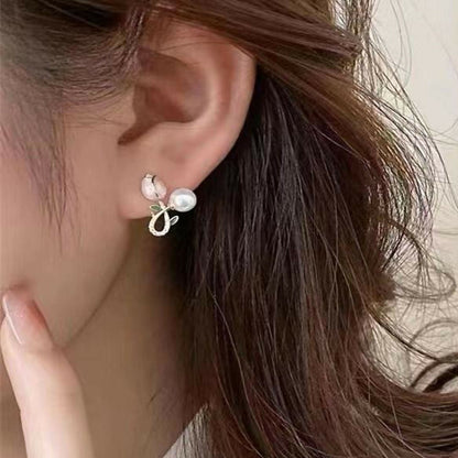 Side view of Pink Tulip & Pearl Earrings highlighting hand-painted enamel details