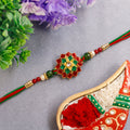 Elaborate Layered Lotus Rakhi Embellished in Red-Green Enamel and a Crystal Core