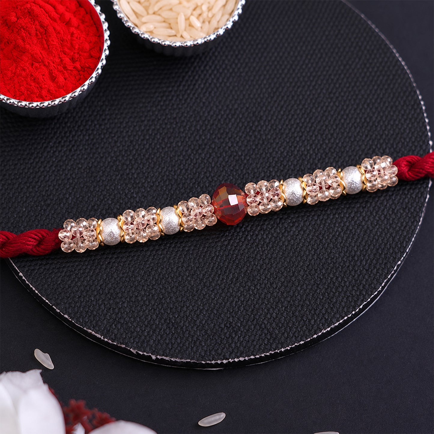 Graceful Pastel Bracelet Rakhi with Silver Centre and Delicate Raksha Bandhan Beauty