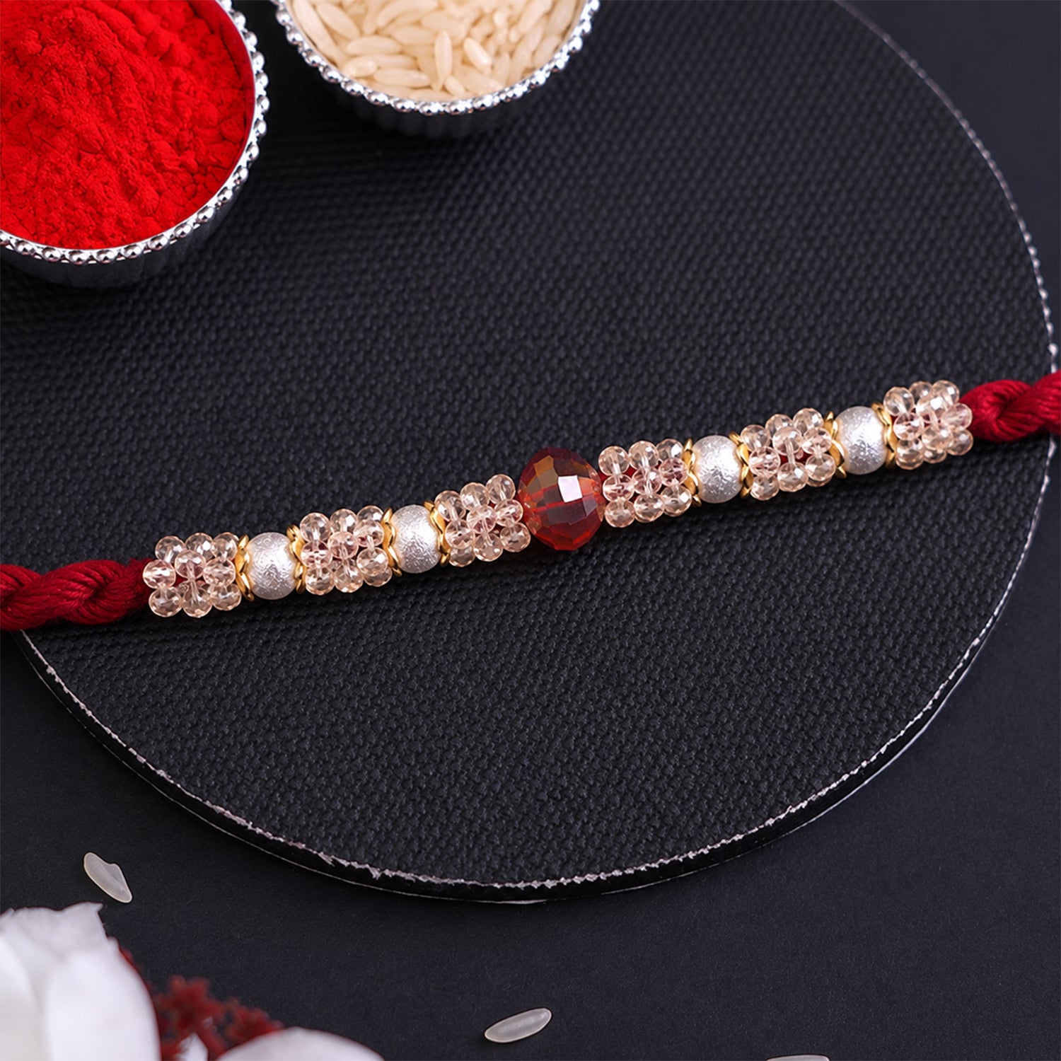 Graceful Pastel Bracelet Rakhi with Silver Centre and Delicate Raksha Bandhan Beauty