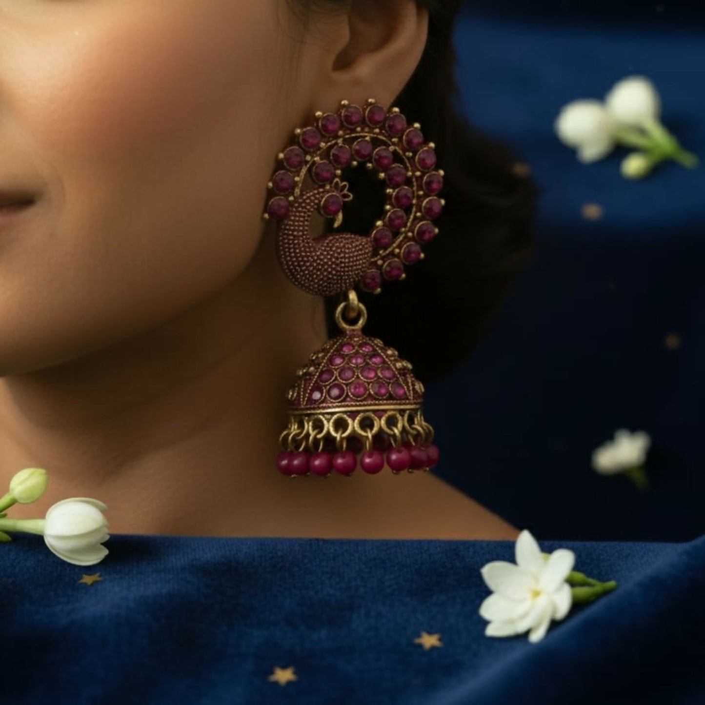 Peacock Motif Ruby-Tone Jhumka Earrings in Antique Gold Finish