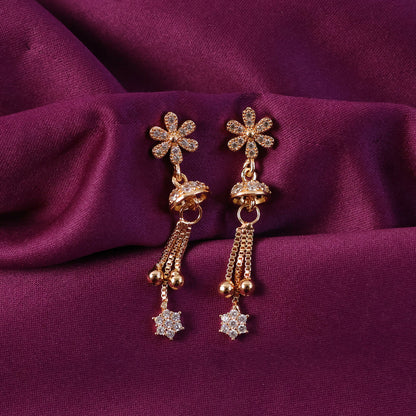 Elegant rose gold drop earrings sparkling in light with floral charm