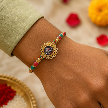 Lord Jagannath Pendant Rakhi with Red Beads