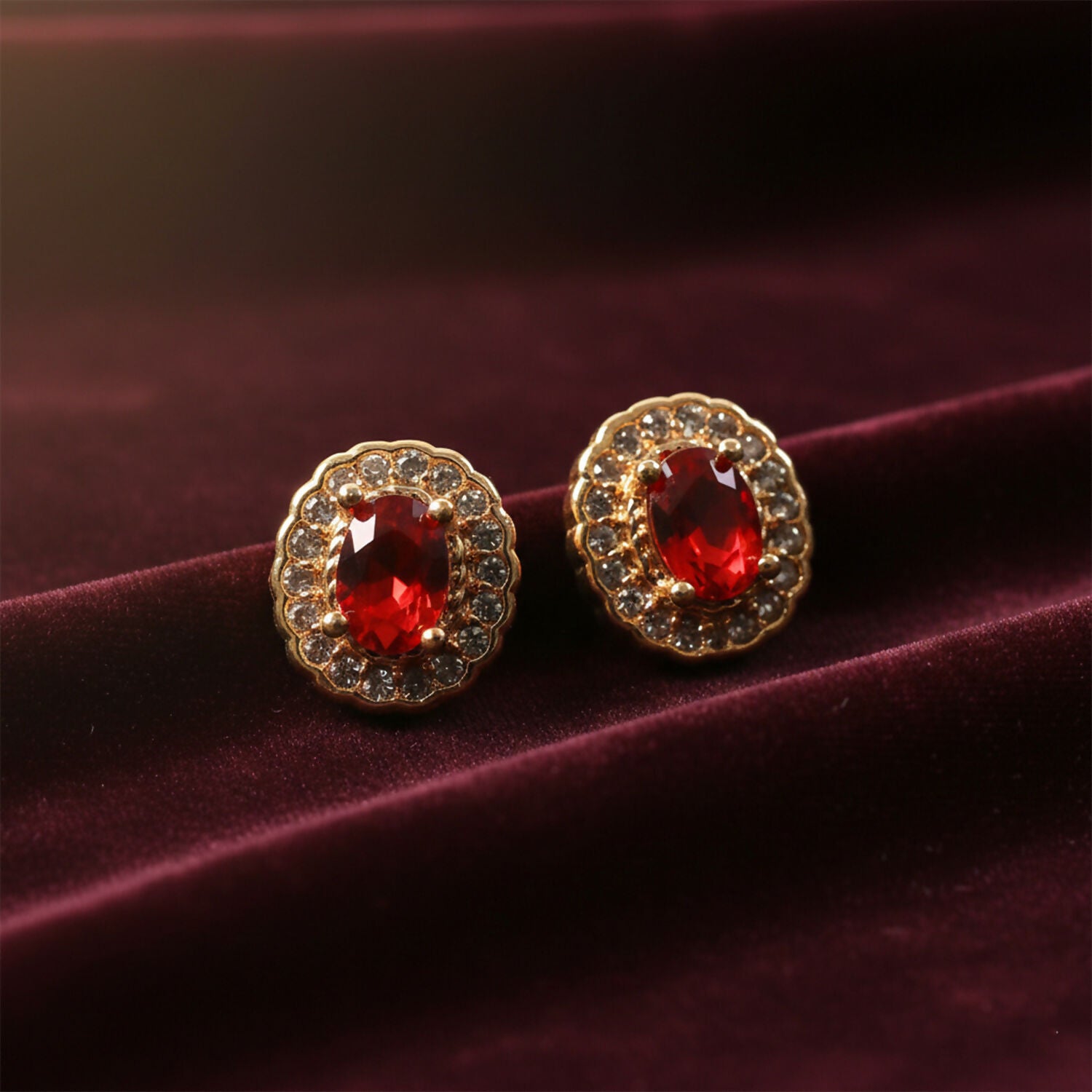 Elegant Oval Red Stone Stud Earrings with Crystal Halo Design