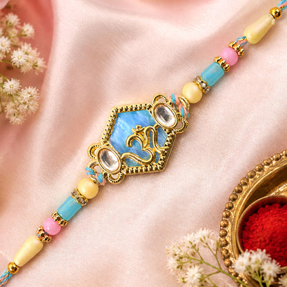 Om Hexagon Pendant Rakhi with Blue Enamel and Kundan Stones