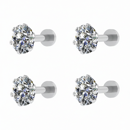 Set of four silver plated round CZ solitaire flat back stud earrings on display