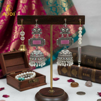 Royal Heirloom Oxidized Silver Jhumka Earrings with Blush Pink Stone, Intricate Hand-Engraved Motifs, Crystal Accents & Pearl Drop Fringe.