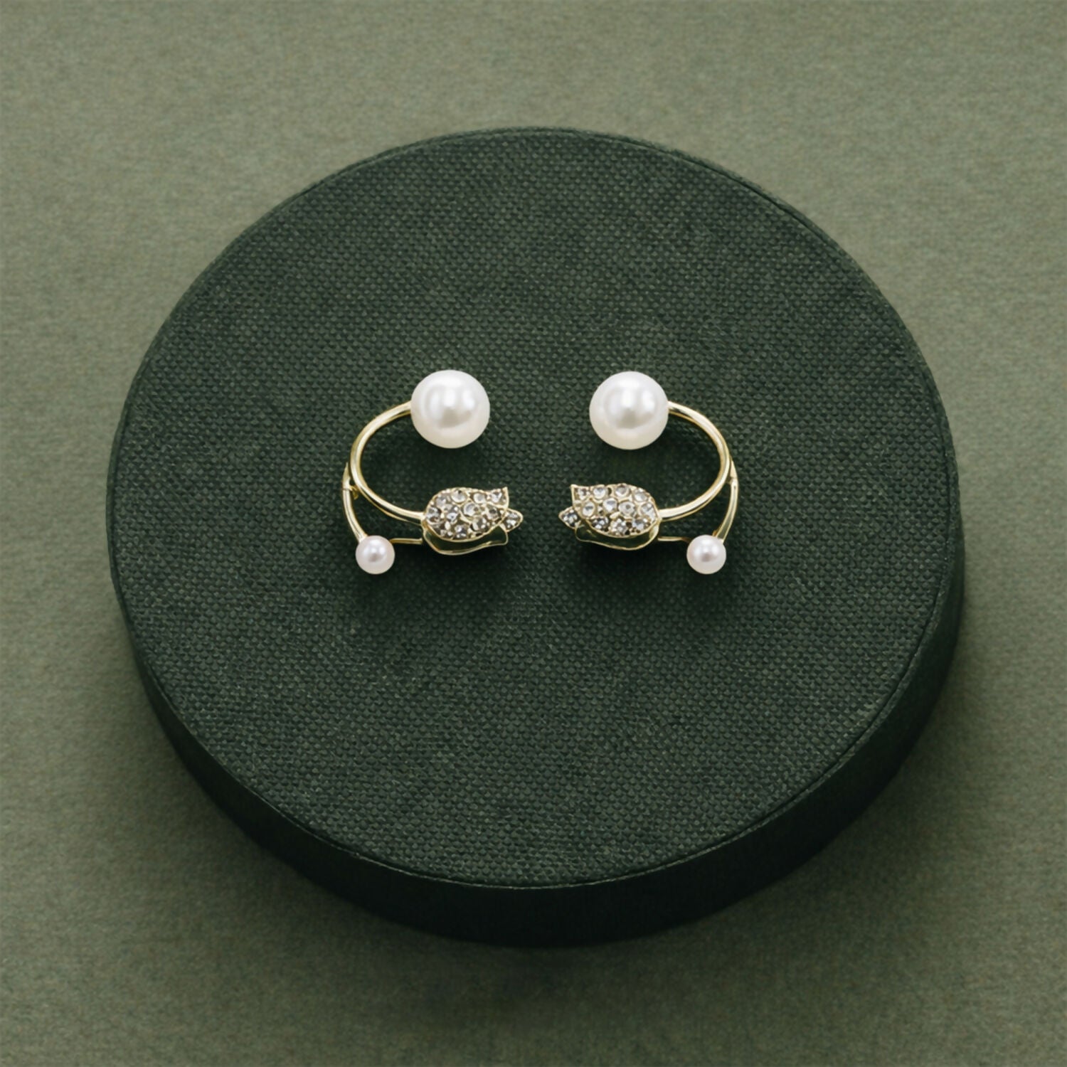 Pearl and stone stud earrings worn by model