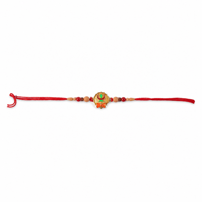 Tiny Trishul Damru Rakhi with Green Stone Center and Minimal Red Thread