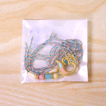 Peacock and Om Enamel Pendant Rakhi with Pastel Beads