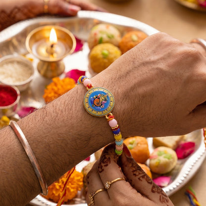 Shop Lord Ganesha Round Coin Designer Rakhi for Raksha Bandhan (10pcs)
