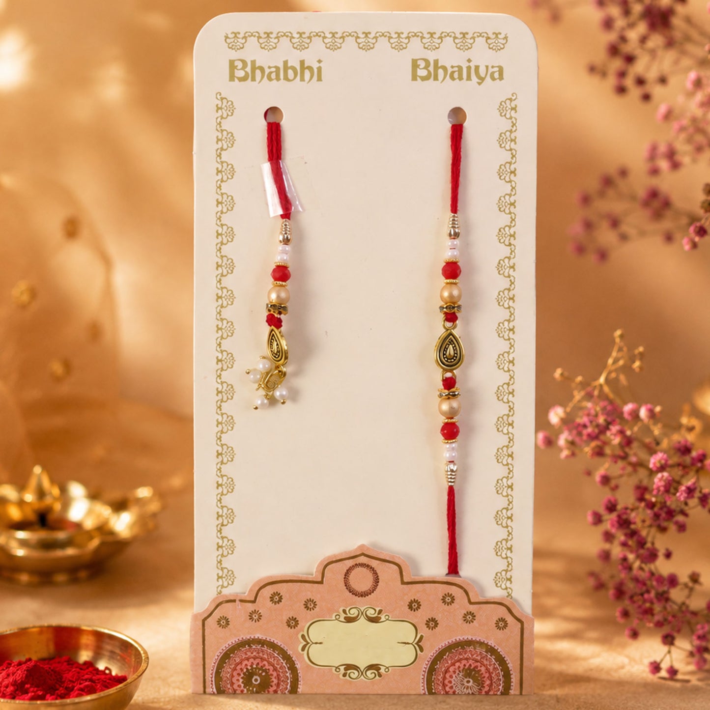Graceful Teardrop Eye Bhai Bhabhi Rakhi with Drop Pendant and Pearl Tassel for Gift