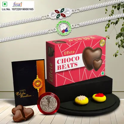 Rakhi Gift Combo with 2 Stylish Rakhis for Brother – Includes Choco Beats Box, Silver Coin, Roli Chawal & Greeting Card