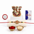 Rakhi for Brother – Ganesh Idol Beautiful Rakhi with Silver Color Pooja Coin