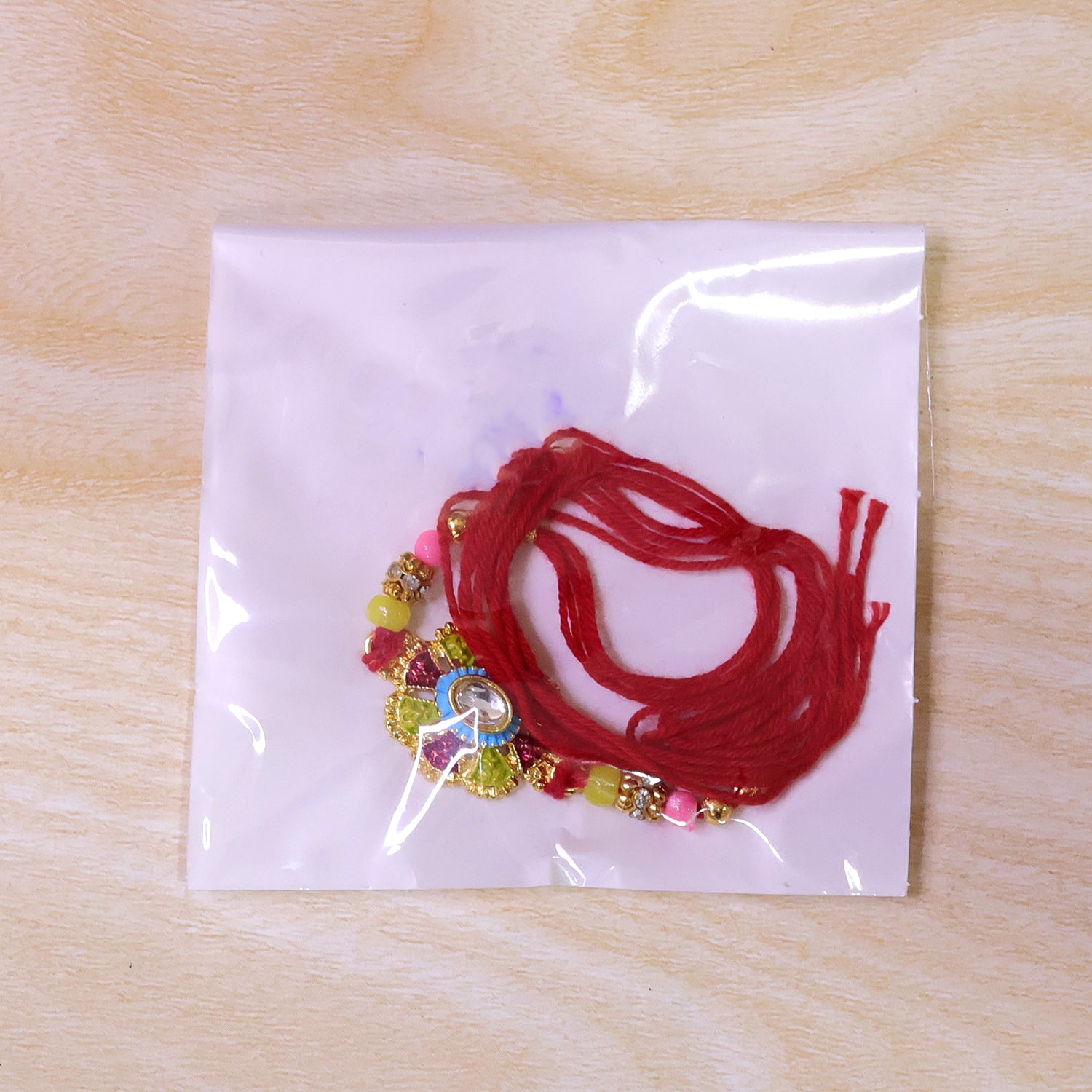 Premium Rakhi with Ornate Floral Medallion and bead line in chain look for Gift Use