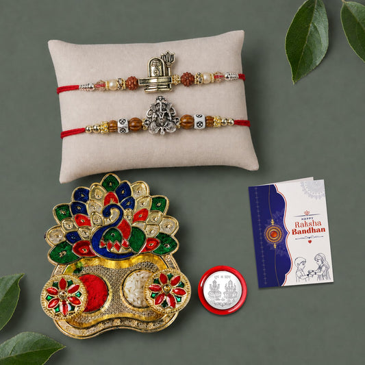 Multicolor Shivling, Ganesha Bracelet/Rakhi & Peacock Shape Pooja Thali with Silver Color Pooja Coin, Tikka/Tilak Set & Greeting Card, Rakhi Gift Hamper (Pack of 6) For Raksha Bandhan