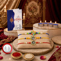 Raksha Bandhan Gift Combo – Flower Bird Om Rakhis with Chocolates