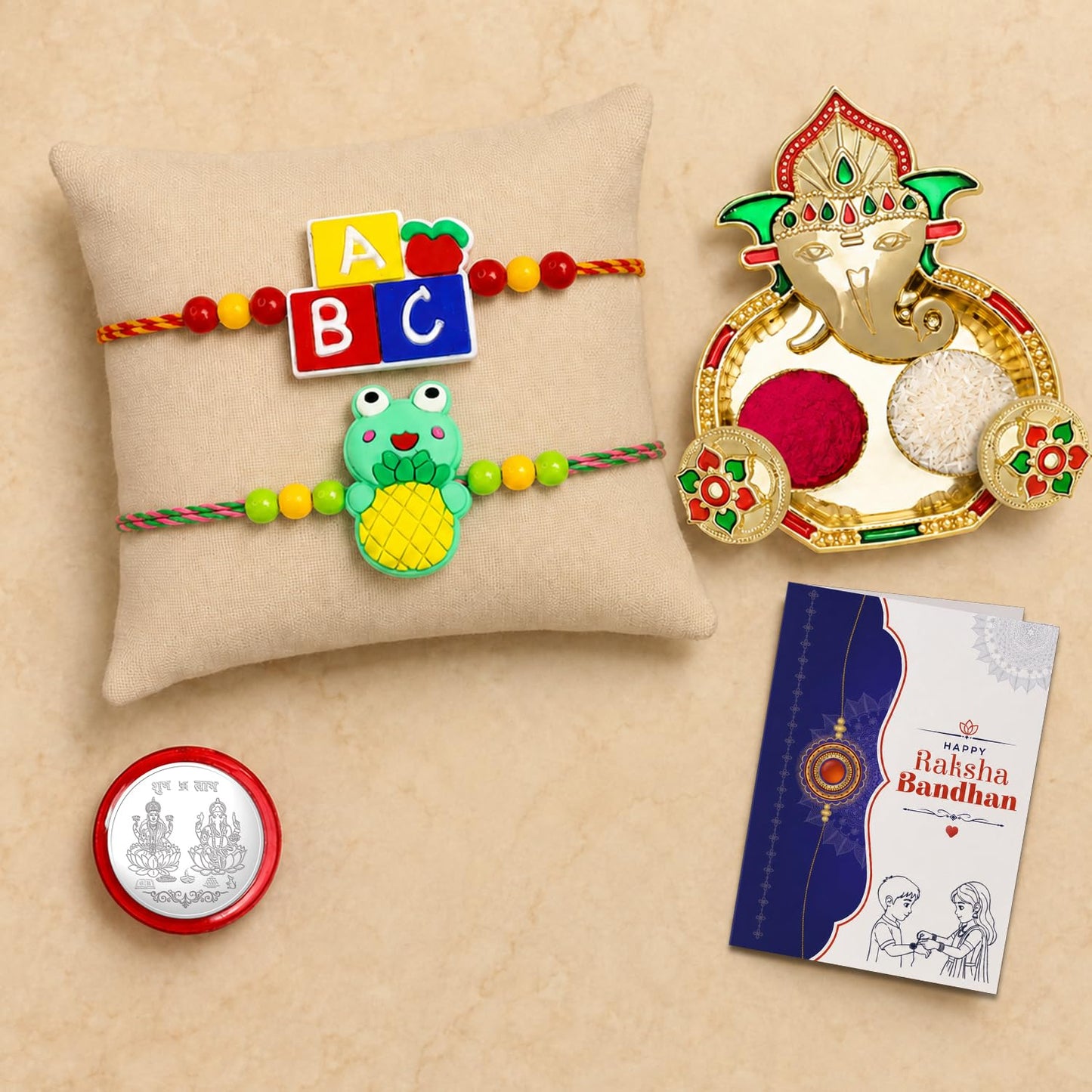 Multicolor Alphabet Blocks, Frog Bracelet/Rakhi & Shri Ganesh Pooja Thali with Silver Color Pooja Coin, Tikka/Tilak Set & Greeting Card, Rakhi Gift Hamper (Pack of 6) For Raksha Bandhan
