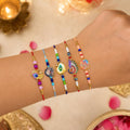 Elegant Artistic Rakhi for Brother with Roli Tikka, Pooja Coin & Card, Pack of 8