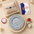 Raksha Bandhan Gift Combo – Peacock Rakhi & Designer Thali Set