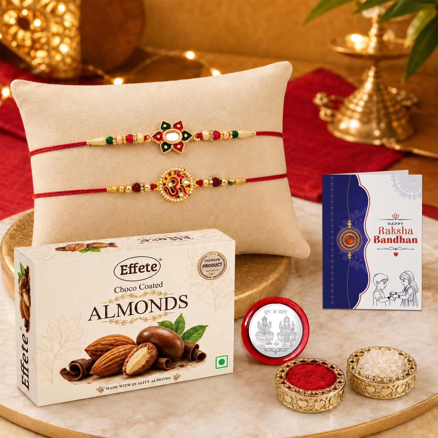 Two ornate red and gold bracelets with decorative centers rest on a light brown pillow, with a box of chocolate almonds and