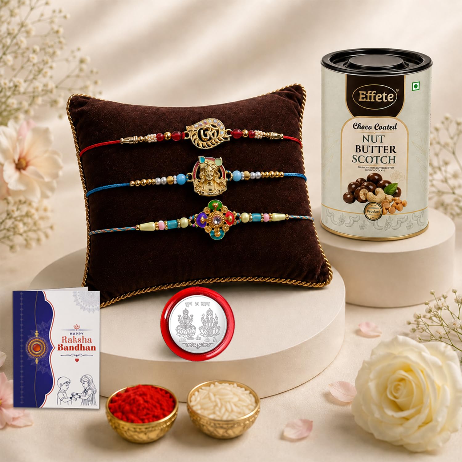 A gift set with three bracelets on a velvet cushion, a tin of butterscotch, a silver coin, and bowls of rice and red powder.