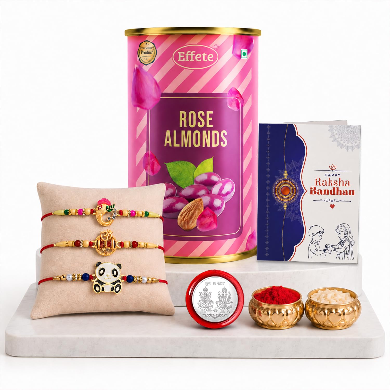 A pink and purple tin of rose almonds, a greeting card, three colorful bracelets on a beige cushion, a silver coin, and two