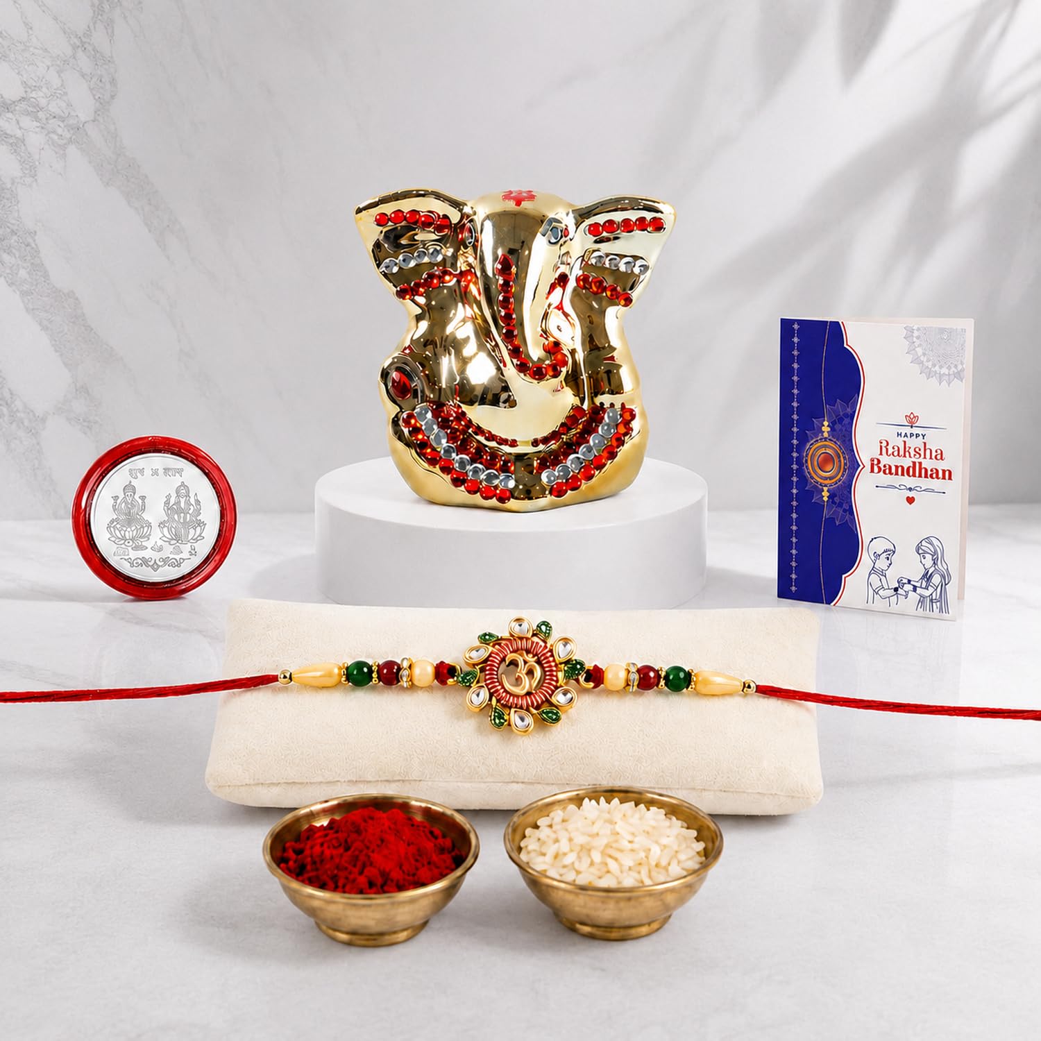 Rakhi for Brother – Ganesh Idol Beautiful Rakhi with Silver Color Pooja Coin