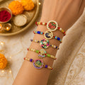 Designer Divine Rakhi for Brother with Roli Tikka, Pooja Coin & Card, Pack of 8