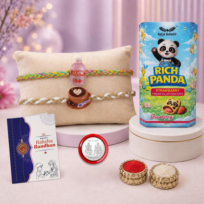 A gift set with a biscuit box, two decorative bracelets on a pillow, a greeting card, a silver coin, and small bowls of